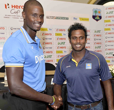 West Indies captain Jason Holder is greeted by Sri Lanka captain Angelo Mathews.