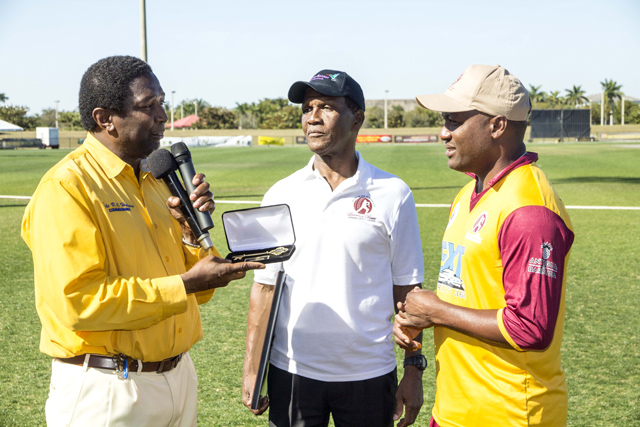County Commissioner Dale Holness presents Brian Lara with the County Key.