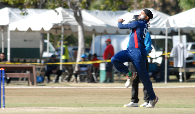Jessy Singh bowls during the final of the ICC World Cricket League Division 4 against Oman. Photo by Shiek Mohamed