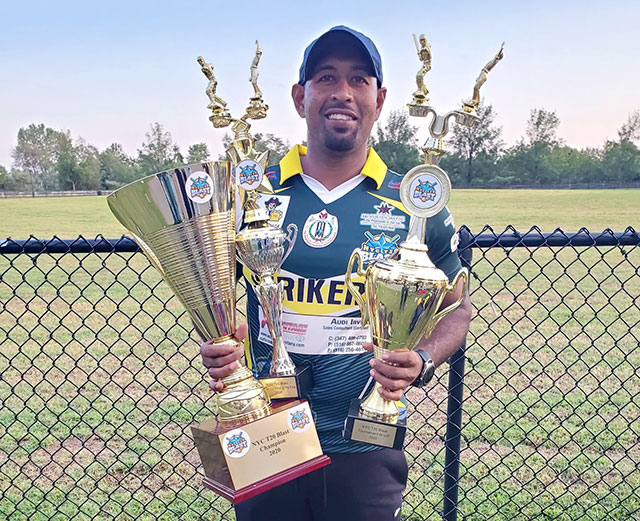 Gajanand Singh poses with trophies
