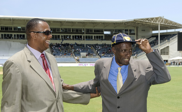 Sir Wes Hall (right) receiving his cap from Courtney Walsh at Sabina Park, Jamaica. Photo by WICB Media/Randy Brooks of Brooks Latouche Photography