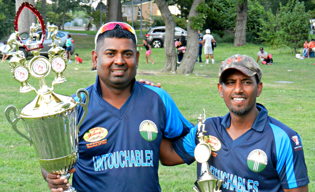 Untouchables skipper Andrew Gonsalves (left) and Amar Singh poses with trophies. 