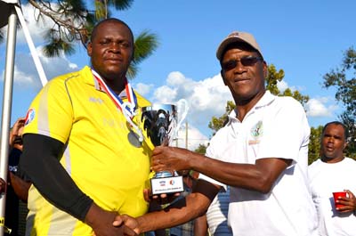 Oneil Hylton All Stars skipper receives runner-up trophy from Windies Test legend Lawrence Rowe.