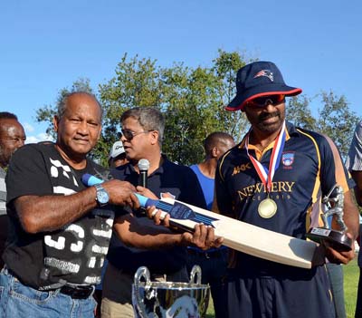 MVP Fazal Alam accepts MVP Newbery Award from Windies Test legend Alvin Kallicharran.