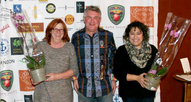 •NVCC President Phil Bourke (center) thanks Clos du Val staff Patti (left) and Rosie (right).