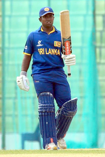 Charith Asalanka of Sri Lanka celebrates his fifty against Afghanistan.