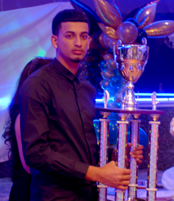Derick Narine of Majestic Cricket Club poses with his MVP trophy. Photo by Shem Rodney