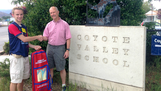 Napa High School senior Caen Healy pictured presenting 6th Grade teacher Jeff Herman of Coyote Valley School with one of two cricket sets courtesy of USYCA and Napa Valley Cricket Club.