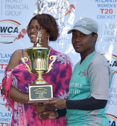 Atlanta Pearls skipper Claudine Beckford accepts championship trophy from GWCA's Ms. Shawna Halley.
