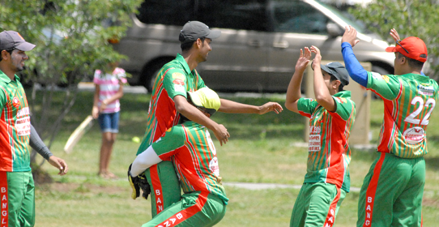 Bangladesh celebrate the fall of a wicket.