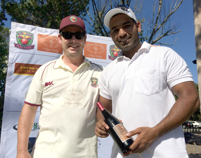 NVCC club captain Rob Bolch (L) presents Param Cheema of the Sonoma Gullies with the Clos du Val Man of the Match Award.