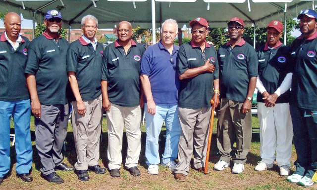 The late Roy Sweeney (4th from right) at the groundbreaking ceremony for the cricket field that will now bear his name.