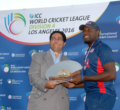USA skipper Steven Taylor (right) collects the winning ICC World Cricket League Division 4 championship plate after USA defeated Oman. Photos by Shiek Mohamed