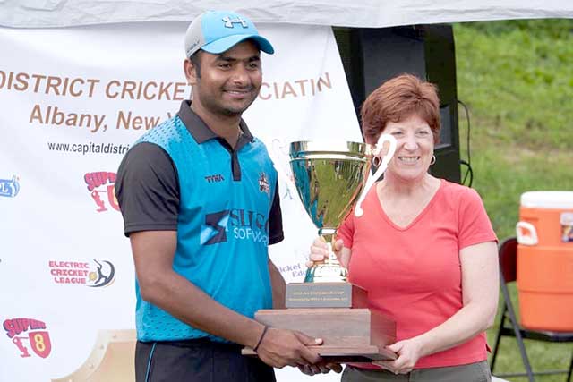 Knights' skipper Raj Ardham collects the winning cup from Mayor Kathy Sheehan.