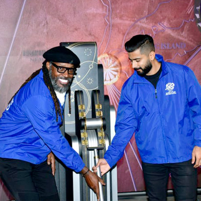 chris gayle and ali khan pulling the lever to light up empire state building